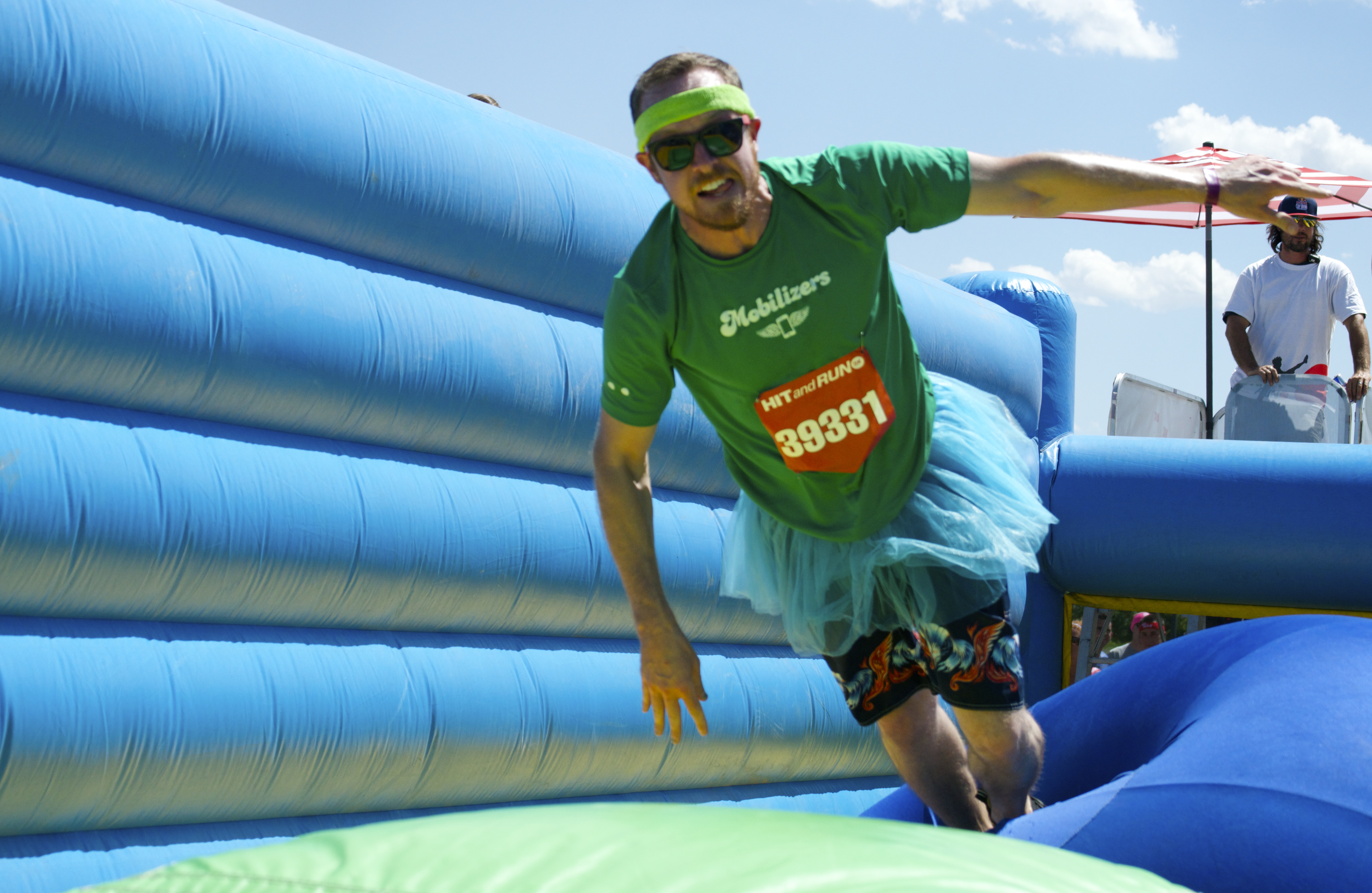 launching through the air in Hit and Run 5k in Denver CO