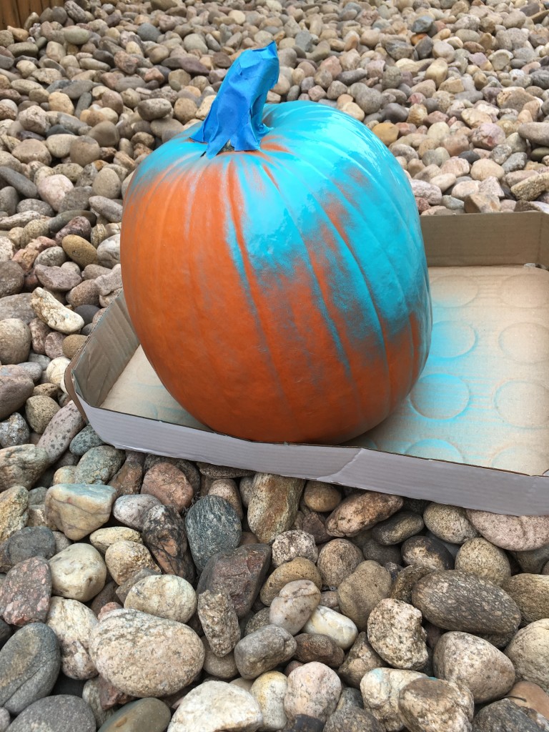 painting teal pumpkin